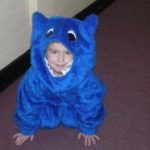 Child in blue costume