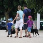 family walking dogs
